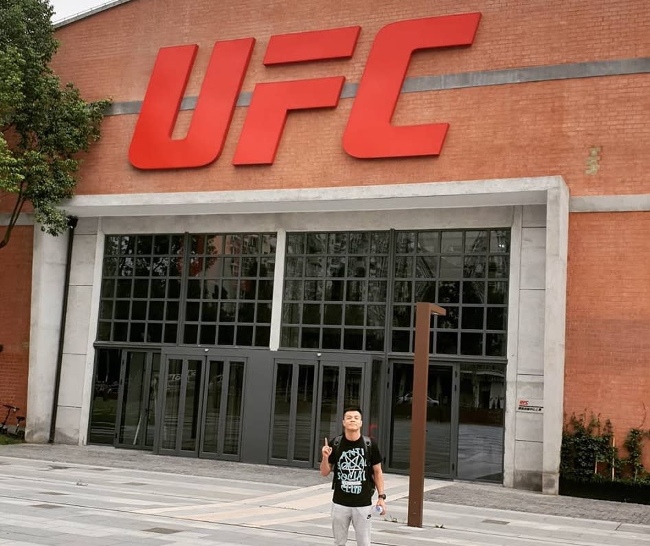 Singapore mixed martial arts fighter Garie Tang posing outside the 93,000 square-foot UFC performance institute in Shanghai. (PHOTO: Garie Tang MMA/Facebook)