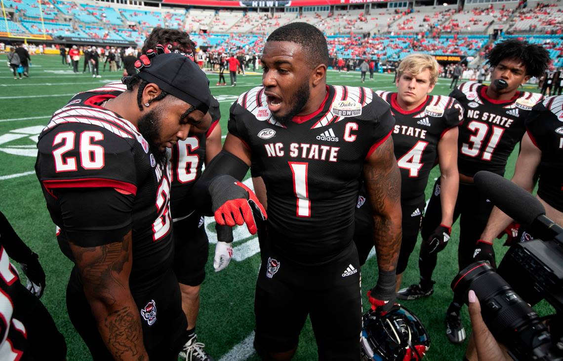 N.C. State linebacker Isaiah Moore (1) pumps up the linebackers before N.C. State’s game against Maryland in the Duke’s Mayo Bowl at Bank of America Stadium in Charlotte, N.C., Friday, Dec. 30, 2022.