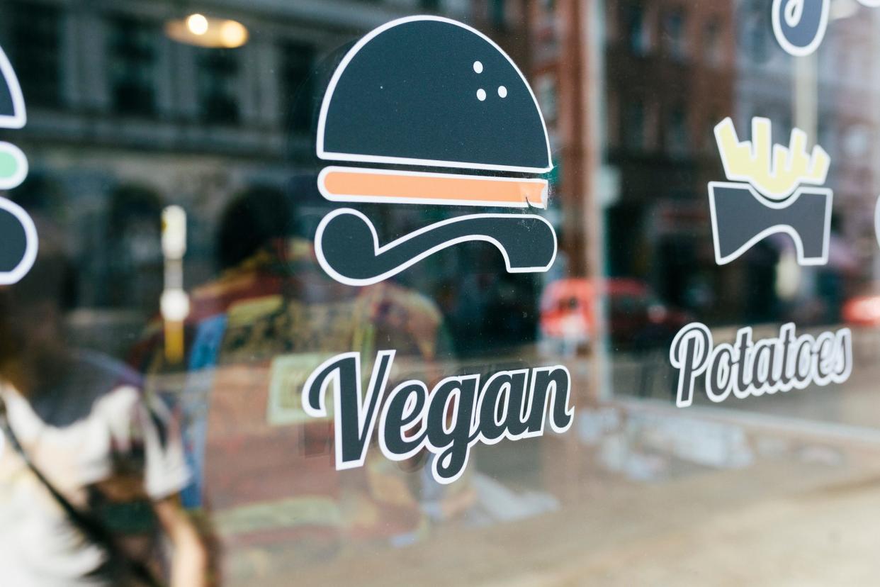 A vegan sign on a restaurant window.