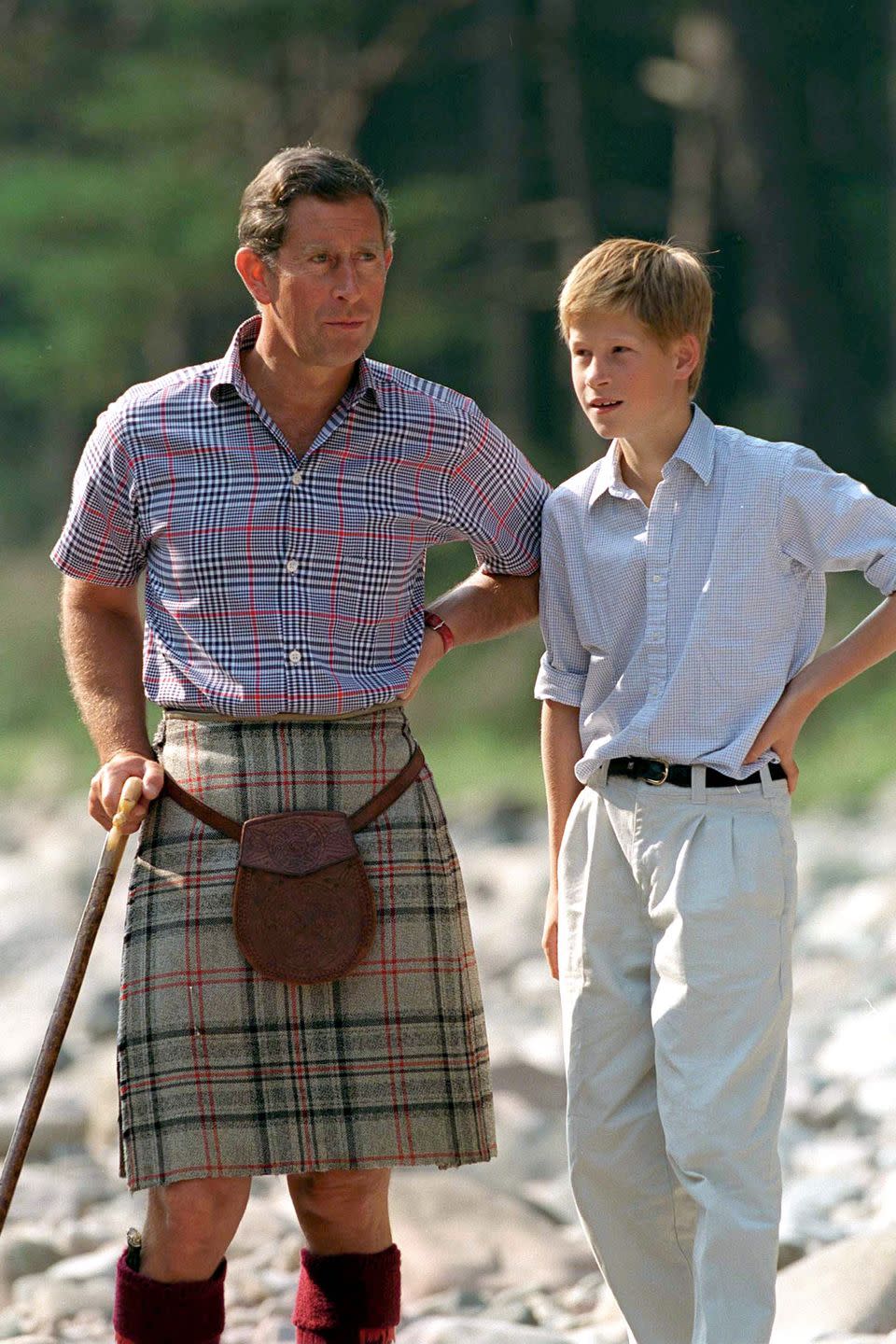 <p>Harry talks with Prince Charles at Balmoral Castle Estate.</p>