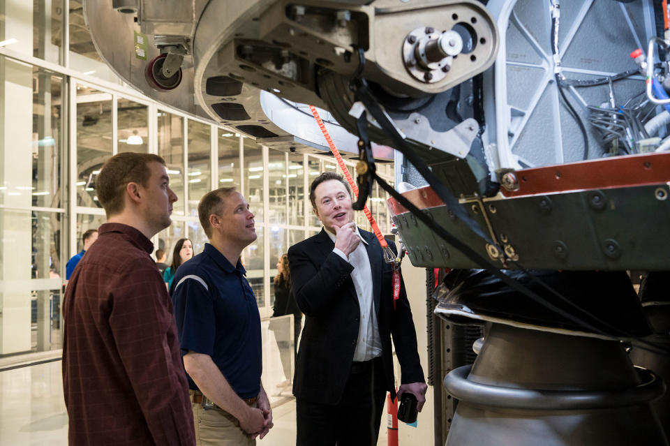 SpaceX Chief Engineer Elon Musk speaks with NASA Administrator Jim Bridenstine while viewing the OctaWeb, part of the Merlin engine used for the Falcon rockets, at the SpaceX Headquarters, in Hawthorne, Calif. on Oct. 10, 2019.<span class="copyright">Aubrey Gemignani—NASA/Getty Images</span>