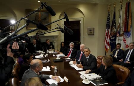 U.S. President Barack Obama speaks during a meeting with members of his national security team and cybersecurity advisors on new actions to enhance the nation's cybersecurity, including measures that are outlined in the President's FY2017 Budget proposal at the White House in Washington February 9, 2016. Flanking Obama are Vice President Joe Biden (L) and Lisa Monaco, Obama's counterterrorism adviser (R). REUTERS/Kevin Lamarque