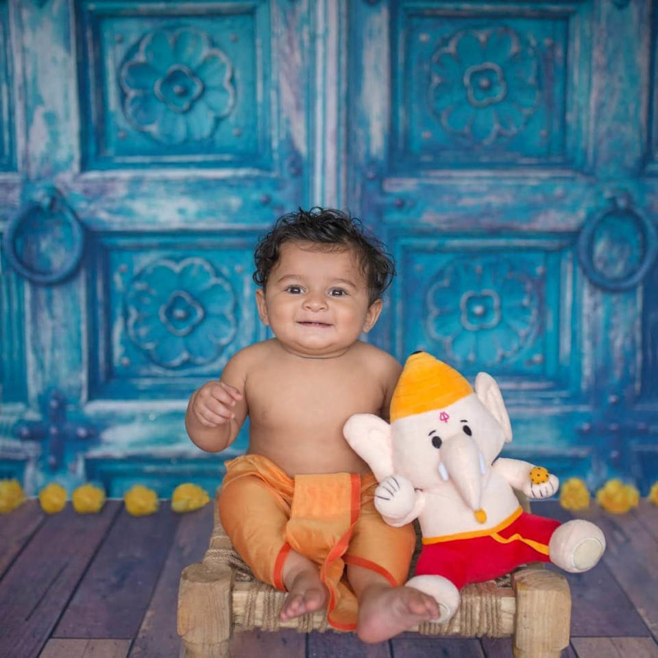 a baby with a plush toy (Courtesy Modi Toys )