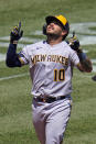 Milwaukee Brewers' Omar Narvaez celebrates as he approaches home plate after hitting a two-run home run off Pittsburgh Pirates starting pitcher Zach Thompson during the fifth inning of a baseball game in Pittsburgh, Sunday, July 3, 2022. (AP Photo/Gene J. Puskar)