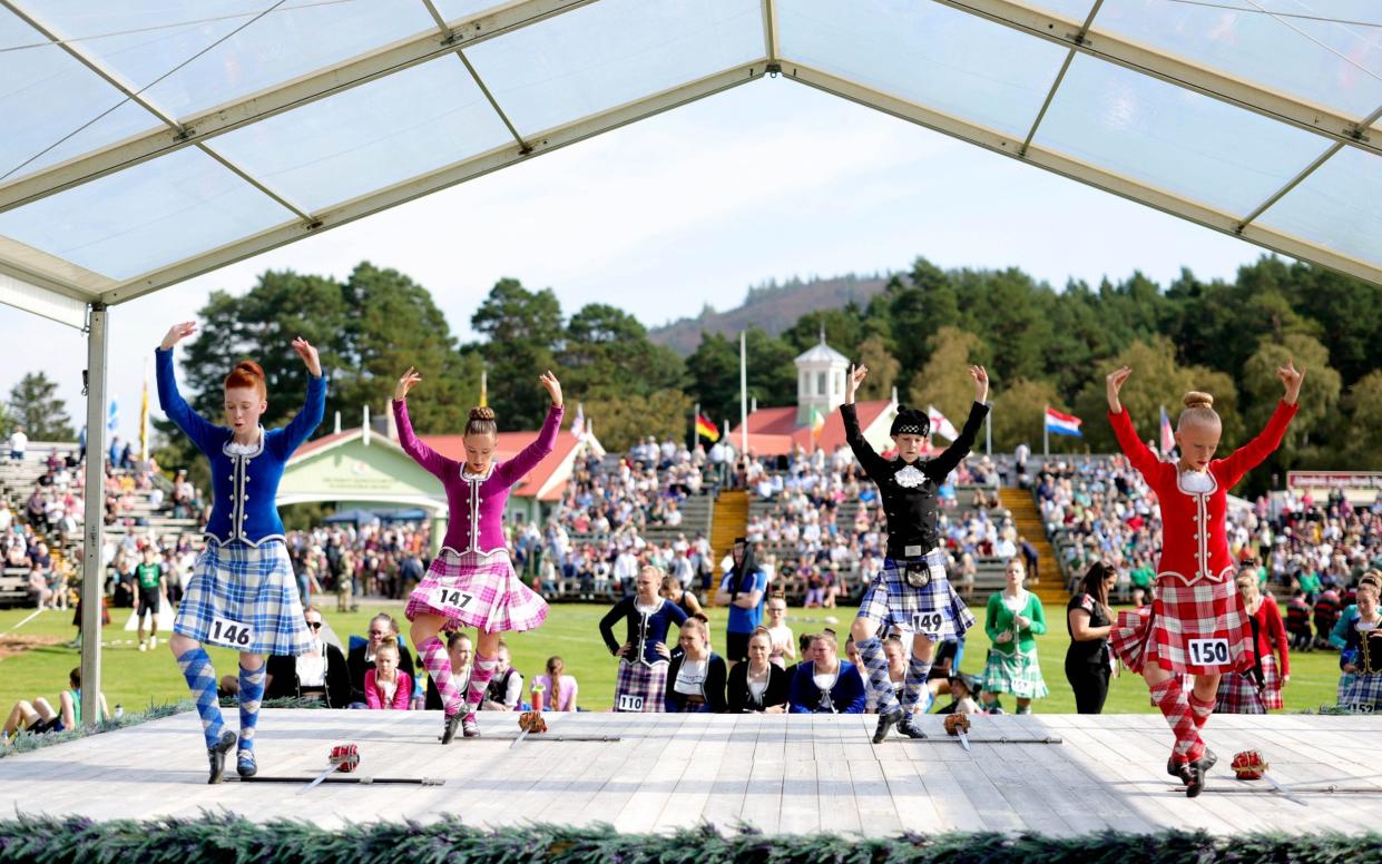 Girls perform traditional Scottish dancing for Their Majesties