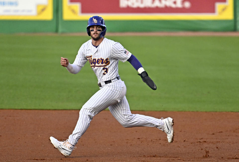 LSU center fielder Dylan Crews (3) follows the pitch from first base during an NCAA college baseball game against Louisiana Tuesday, April 18, 2023, at Alex Box Stadium on the campus of LSU in Baton Rouge, La. The LSU Tigers enter the NCAA baseball tournament with the top two prospects in this summer's major baseball draft spearheading their postseason push. Centerfielder Dylan Crews is hitting .420 and was named the SEC player of the year. He's the consensus top prospect in this July's amateur draft. Next is 6-foot-6, 247-pound pitcher and Air Force transfer Paul Skenes. The righty throws 100 miles per hour, leads the nation with 167 strikeouts and was named SEC pitcher of the year. (Hilary ScheinukThe Times-Picayune/The New Orleans Advocate via AP)