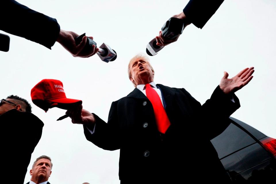 PHOTO: Republican presidential candidate Donald Trump talks to reporters while visiting the polling site at Londonderry High School on January 23, 2024 in Londonderry, New Hampshire. (Chip Somodevilla/Getty Images)