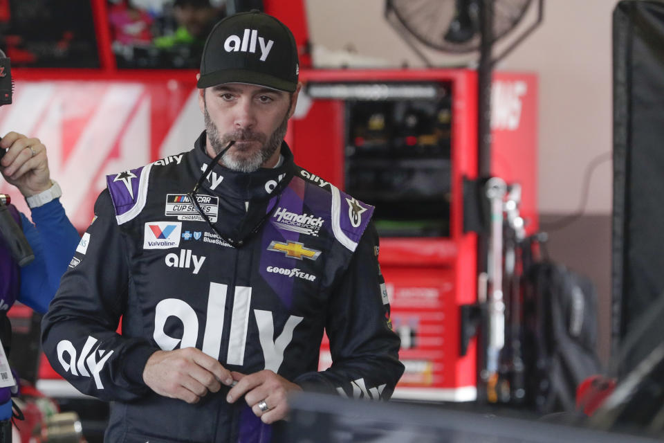 FILE - In this Feb. 15, 2020, file photo, Jimmie Johnson gets ready for a practice session for the NASCAR Daytona 500 auto race at Daytona International Speedway in Daytona Beach, Fla. Jimmie Johnson wanted to retire from full-time racing to step away from NASCAR's 11-month grind. The coronavirus pandemic has brought his final season to an unexpected pause, and now the seven-time champion isn't sure what his future holds.(AP Photo/John Raoux, File)