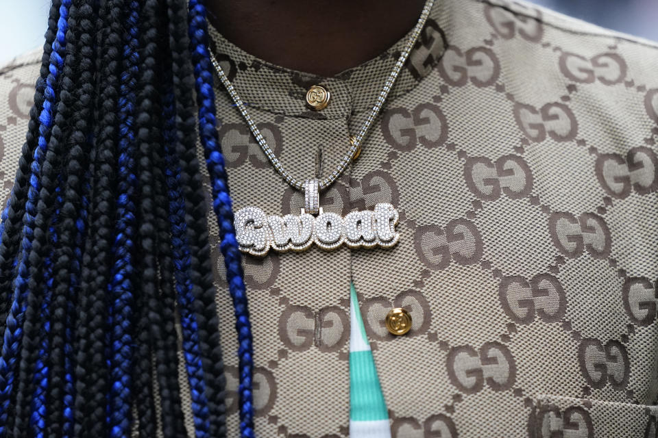 Two-time Olympic gold medalist and women's world middleweight champion Claressa Shields wears a "Greatest Woman Of All Time" necklace during an interview at Little Caesars Arena, Tuesday, April 18, 2023, in Detroit. Shields will fight Hanna Gabriels of Costa Rica on June 3. (AP Photo/Carlos Osorio)