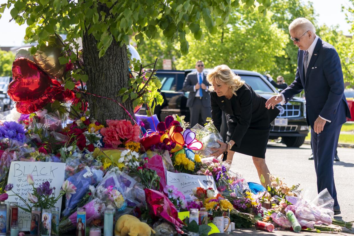 President Biden and First Lady Jill Biden pay their respects to the victims of Saturday's shooting at a memorial across the street from the TOPS Market in Buffalo, N.Y., Tuesday, May 17. 