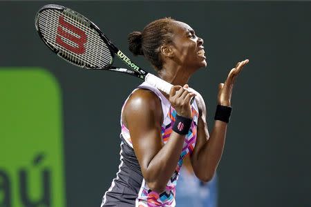 Mar 31, 2015; Key Biscayne, FL, USA; Venus Williams reacts to missing a shot against Carla Suarez Navarro (not pictured) on day nine of the Miami Open at Crandon Park Tennis Center. Navarro won 0-6, 6-1, 7-5. Mandatory Credit: Geoff Burke-USA TODAY Sports