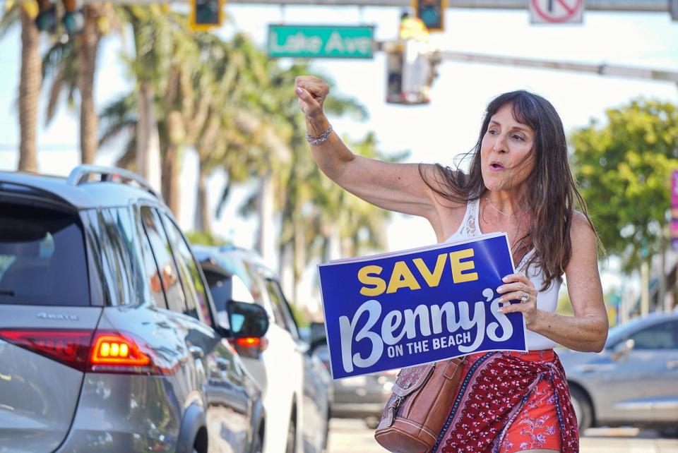 Adriane Shochet, a resident of Lake Worth Beach, protests outside of City Hall before the May 2 commission meeting.