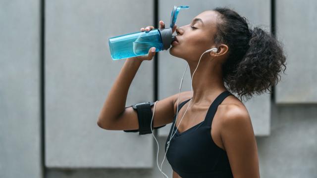 Its Important Stay Hydrated Young Woman Drinking Her Water Bottle Stock  Photo by ©PeopleImages.com 658049610