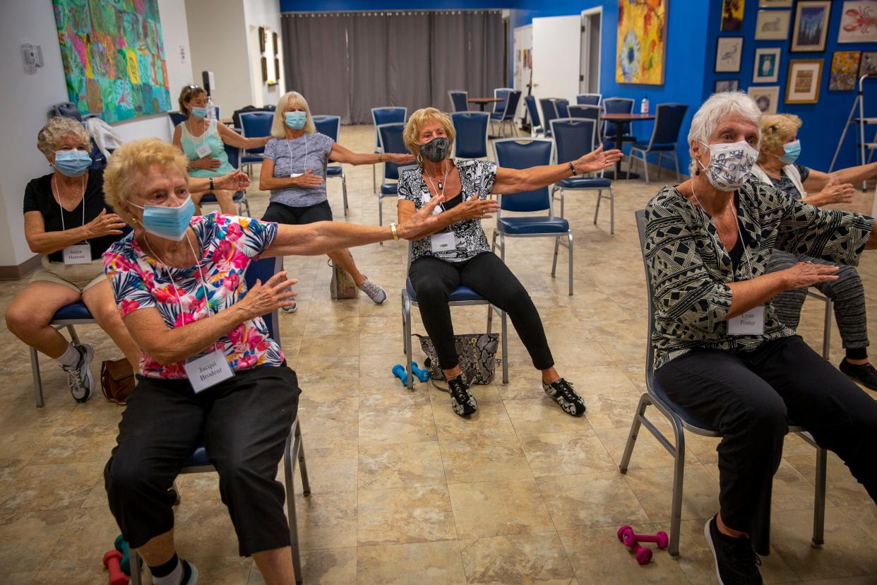 Members of the Naples Senior Center participate in a chair aerobics class on Aug. 4. After being closed 500 days because of the COVID-19 pandemic, the center reopened for in-person programs and service on Aug. 2.