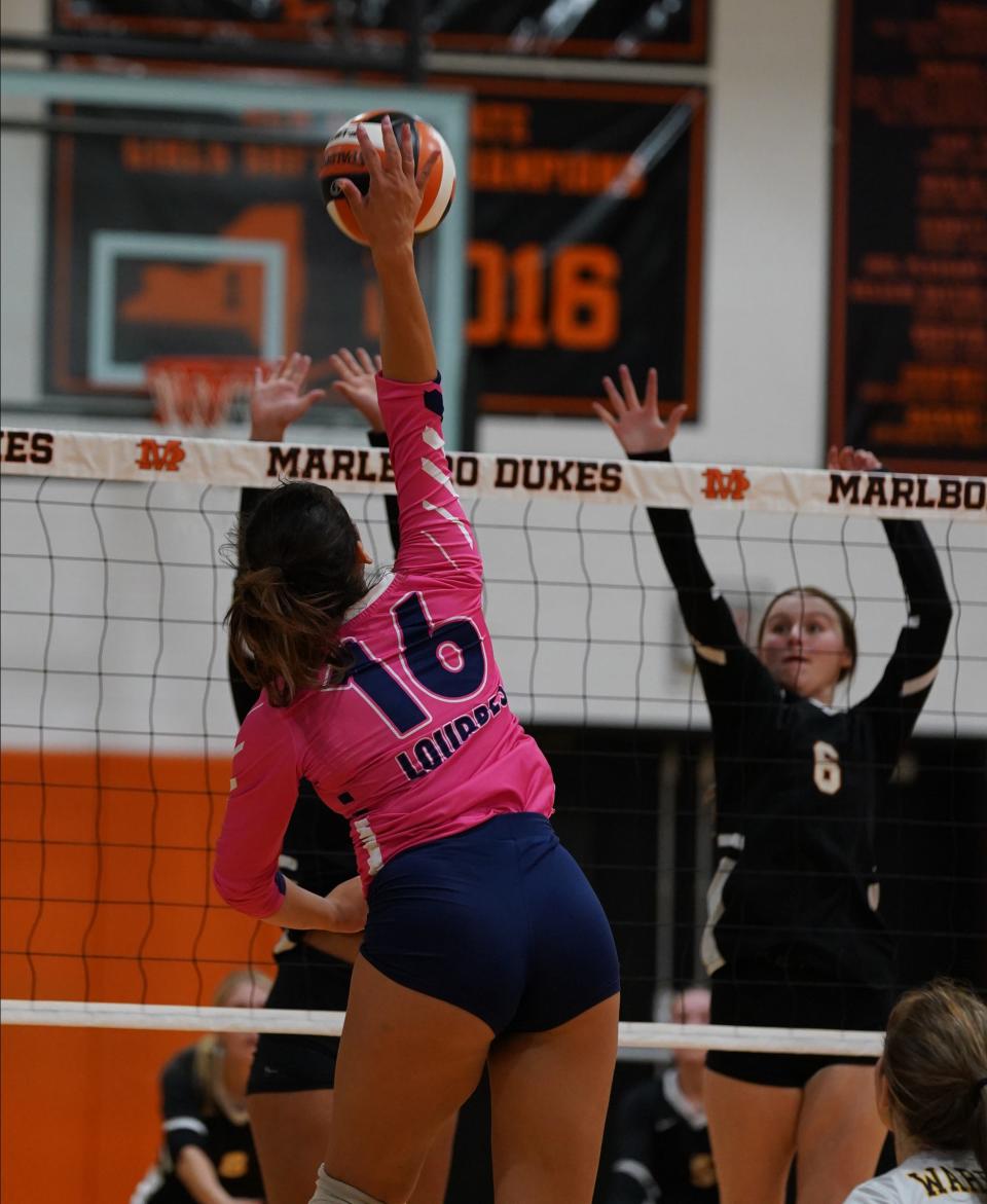 Our Lady of Lourdes' Alex Zangerle goes up for a return against Marlboro during a volleyball game on Oct. 11, 2022.