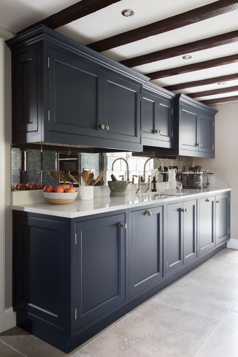 a kitchen with black cabinets