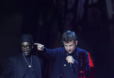 Damon Albarn of Gorillaz accepts the award for British group at the Brit Awards at the O2 Arena in London, Britain, February 21, 2018. REUTERS/Hannah McKay