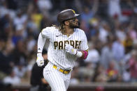 San Diego Padres' Fernando Tatis Jr. watches his solo home run off Cincinnati Reds starting pitcher Wade Miley during the sixth inning of a baseball game Thursday, June 17, 2021, in San Diego. (AP Photo/Derrick Tuskan)
