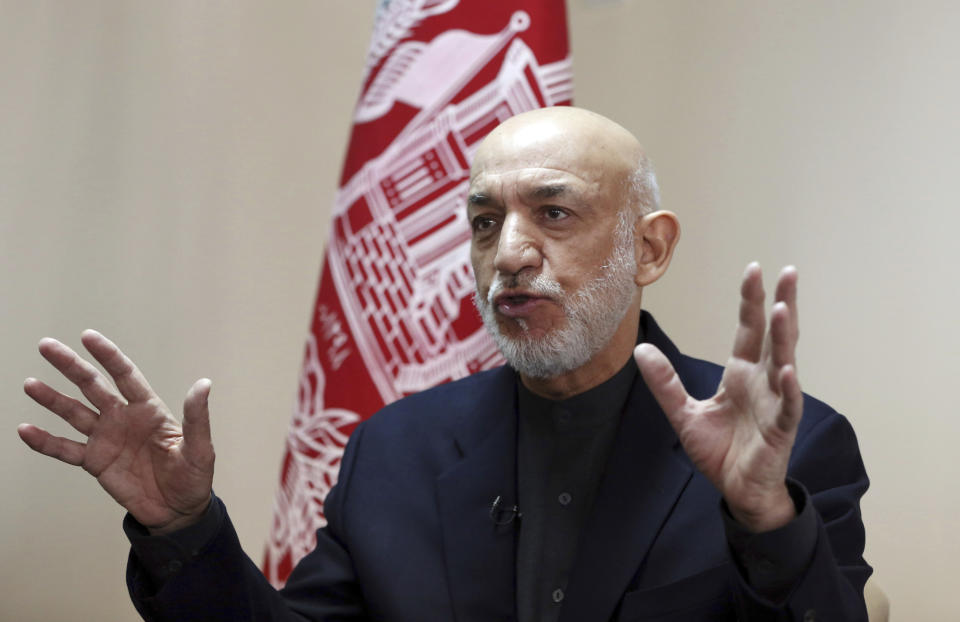 Former Afghan President Hamid Karzai speaks during an interview with The Associated Press in Kabul, Afghanistan, Saturday, Feb. 16, 2019. Karzai expressed fears that a previously unscheduled meeting between the Taliban and the United States in Pakistan on Monday risks engulfing Afghanistan into regional rivalries, as its neighbors and powerful Persian Gulf states jockey for influence in a post- U.S. Afghanistan. (AP Photo/Rahmat Gul)