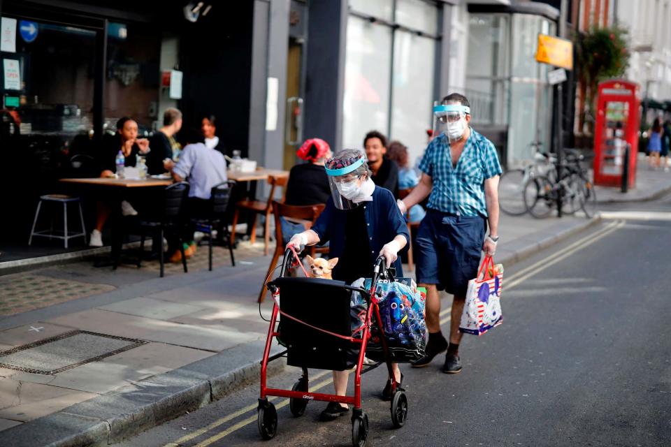 Londoners out and about during sunny weather after lockdown restrictions were eased (AFP via Getty Images)