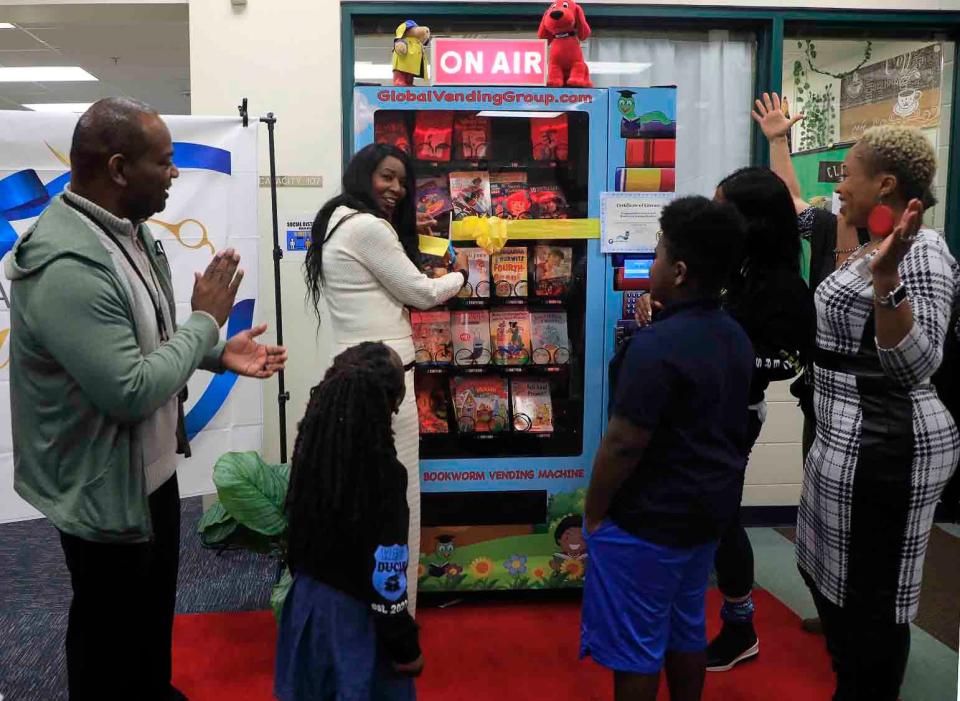 Daytona Beach Commissioner Dannette Henry, Principal Dwayne Copeland, Black Educators Rock CEO Melissa Noland Chester and Media Specialist Lakeisha Byrd cut the ribbon for the grand opening of Westside Elementary's new book vending machine.