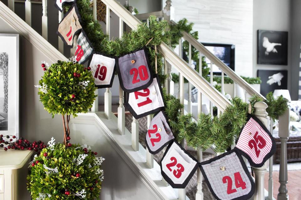 In this photo provided by Brian Patrick Flynn, the designer Flynn for HGTV.com uses swatches of mens' shirt fabrics to create this holiday garland that also serves as an advent calendar. Use it to bring color and holiday style to a staircase, and tuck tiny gifts inside. (AP Photo/Brian Patrick Flynn, HGTV.com Holiday House)