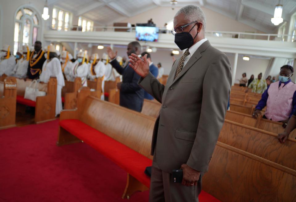 Herbert Barnette, deacon at Zion Baptist Church, bows his head in prayer, during service on Sunday, April 16, 2023, in Columbia, S.C. Barnette says there is still a fear of COVID and that he will continue to wear a mask and social distance himself when attending church in person. (AP Photo/Jessie Wardarski)