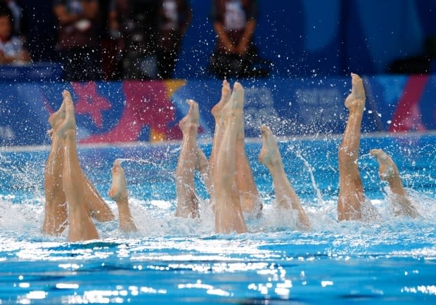 Canada's artistic swimming team won gold at the 2019 Pan American Games in Peru. In 2020, allegations surfaced of abuse and now five women have come forward to request a class action lawsuit against the sport federation. (Moises Castillo/The Associated Press - image credit)