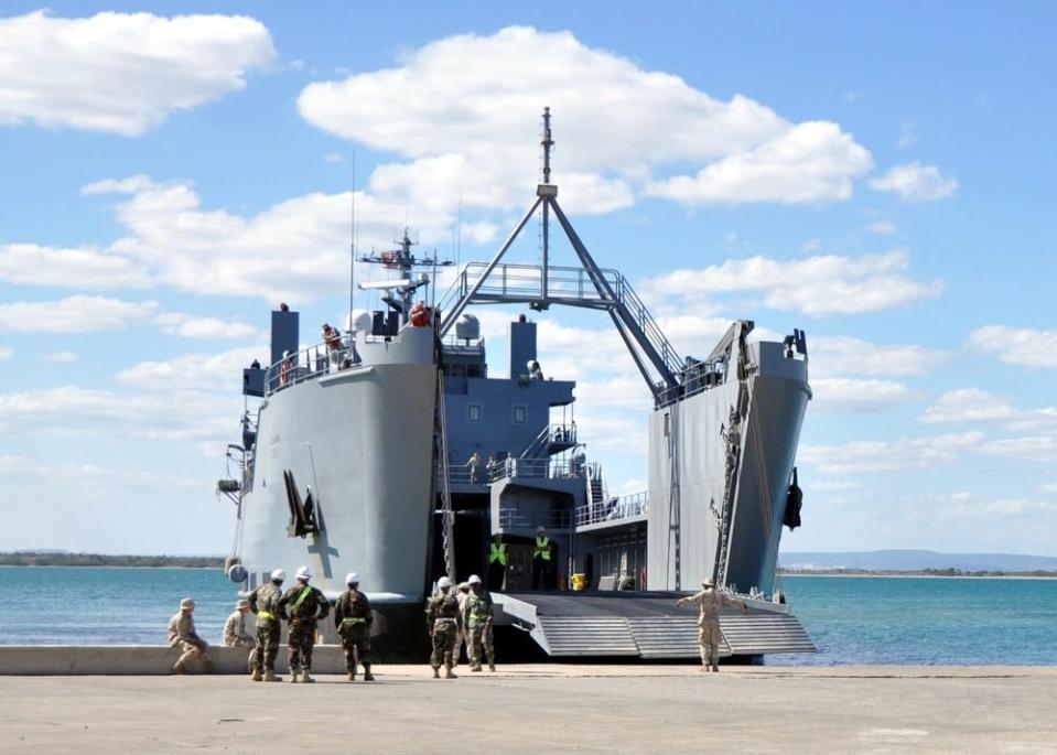 logistics support vessel General Frank S. Besson Jr. is guided into a landing