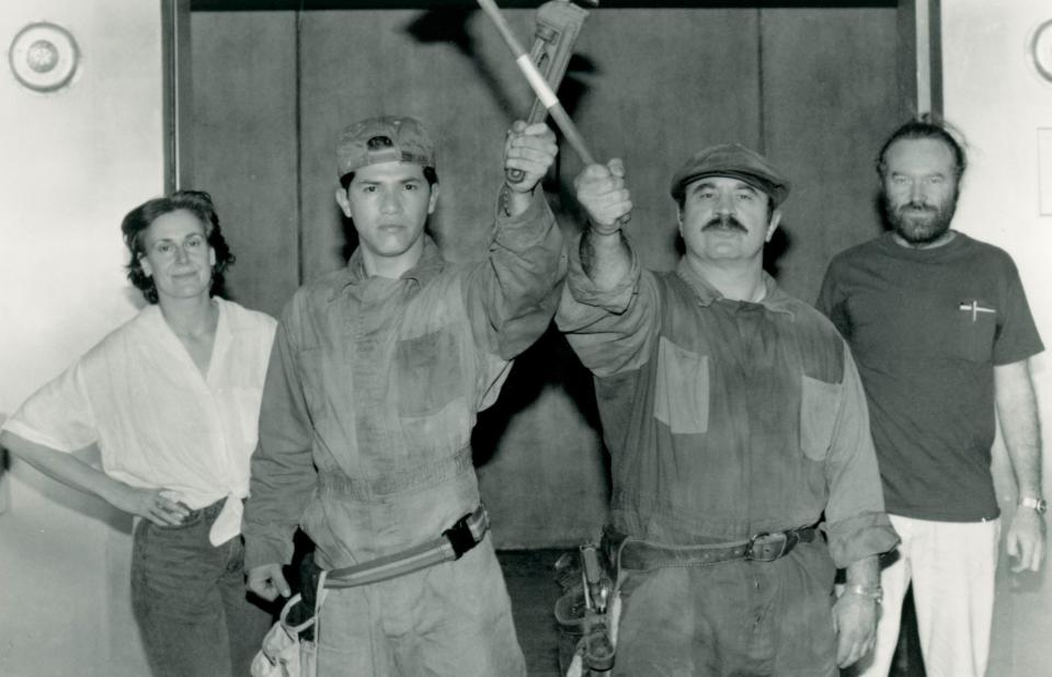 producers posing with the mario and luigi actors