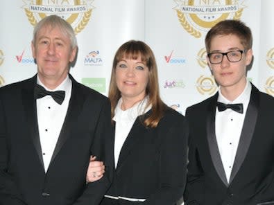 Archie Lyndhurst (right) pictured with his parents, Nicholas and LucyInstagram
