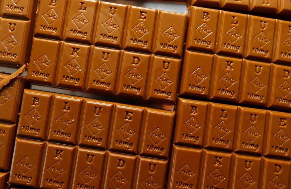 Candy bars marked with Colorado's new required diamond-shaped stamp noting that the product contains marijuana, are displayed in Denver on Monday, Sept. 19, 2016. State officials require the stamp to be put directly on edibles after complaints that the treats look too much like their non-intoxicating counterparts.