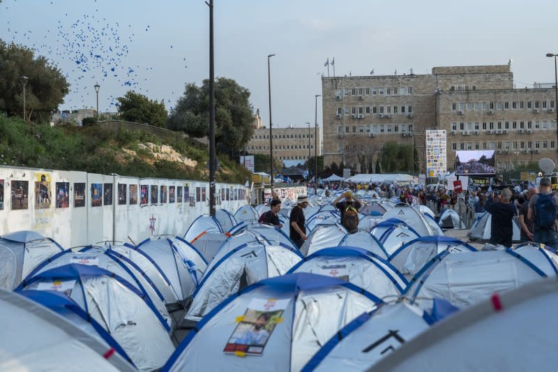 On Tuesday, as hundreds of protesters gather in tents in Jerusalem, balloons are released near the Knesset during the continuing mass protests. Photo by Jim Hollander/UPI