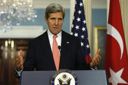 U.S. Secretary of State John Kerry answers a question as he and Turkish Foreign Minister Ahmet Davutoglu speak to reporters at the State Department in Washington November 18, 2013. REUTERS/Kevin Lamarque