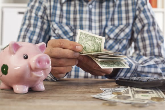 Older man counting money