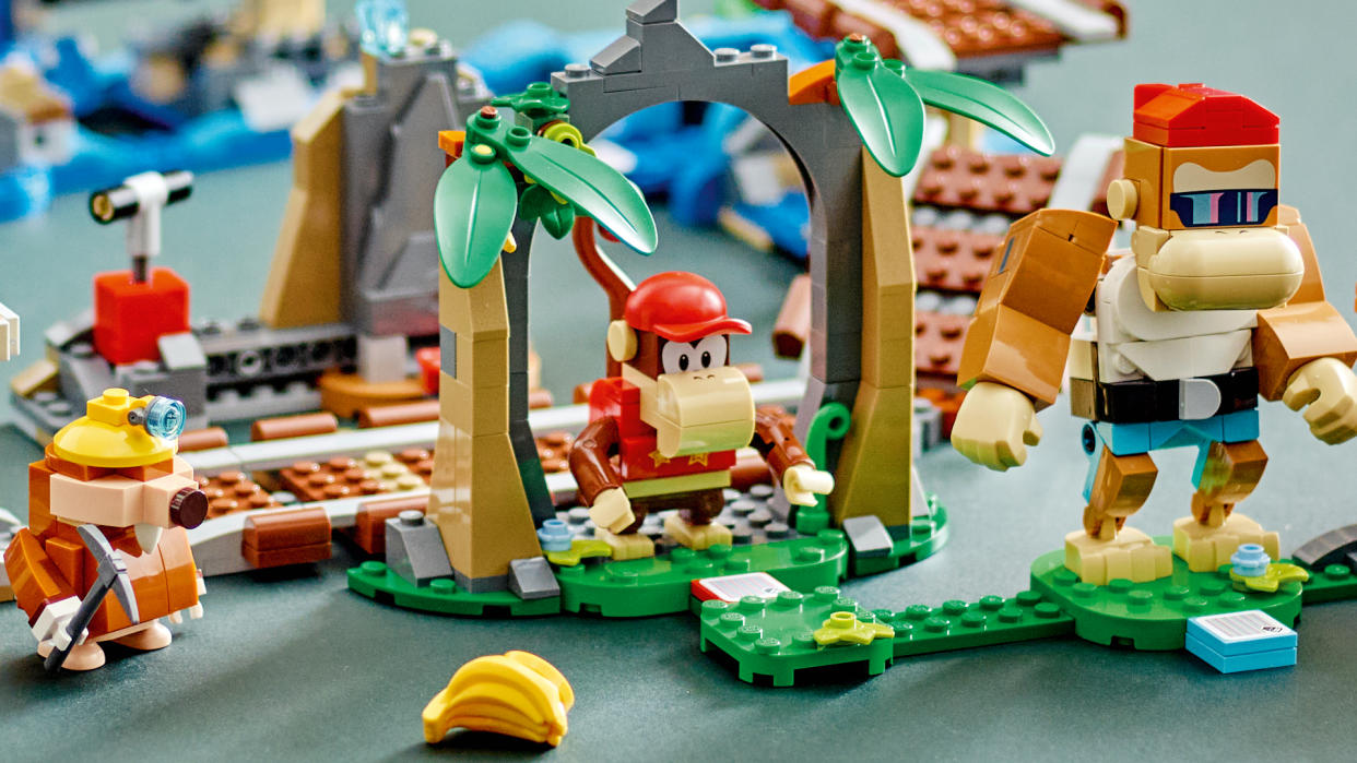  Lego Diddy Kong, Funky Kong, and Mole Miner in front of the mine cart set 