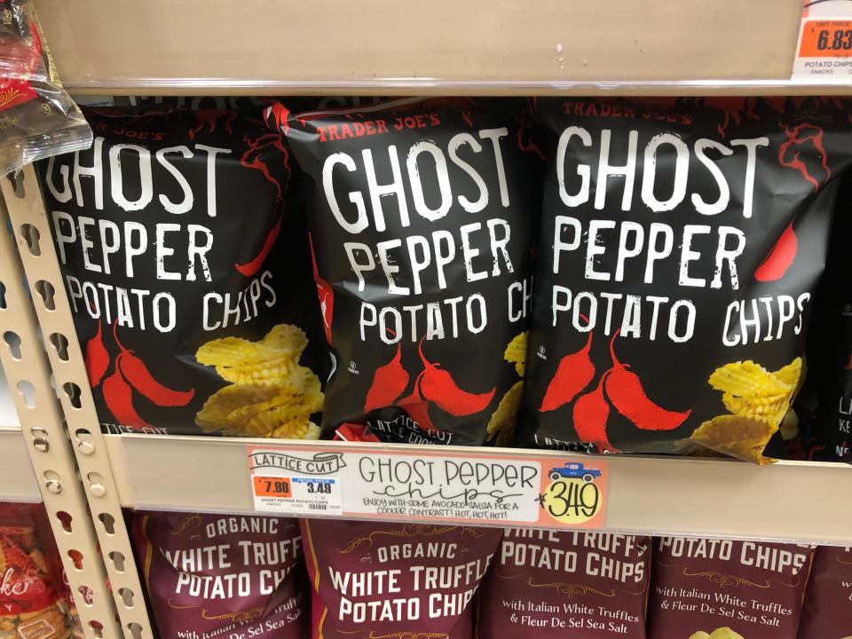 Bags of Trader Joe's ghost-pepper potato chips on a shelf. 