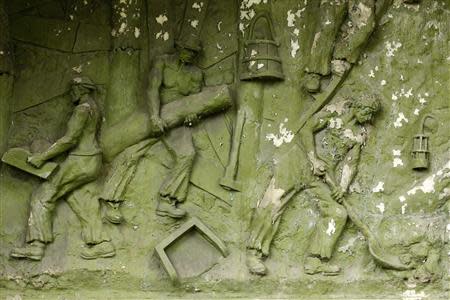 A bas-relief is seen at a derelict coal mine in Aninoasa, 330 km (202 miles) west of Bucharest July 30, 2013. REUTERS/Bogdan Cristel