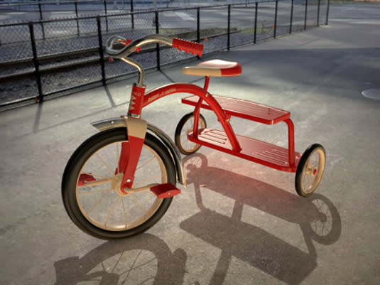 A red tricycle on a street