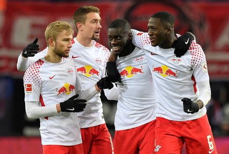 Soccer Football - Bundesliga - RB Leipzig vs Bayern Munich - Red Bull Arena, Leipzig, Germany - March 18, 2018 RB Leipzig's Ibrahima Konate, Dayot Upamecano, Konrad Laimer and team mates celebrate after the match REUTERS/Matthias Rietschel