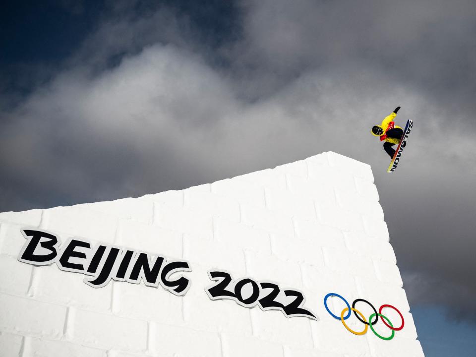 Snowboarder near Great Wall at Beijing Olympics