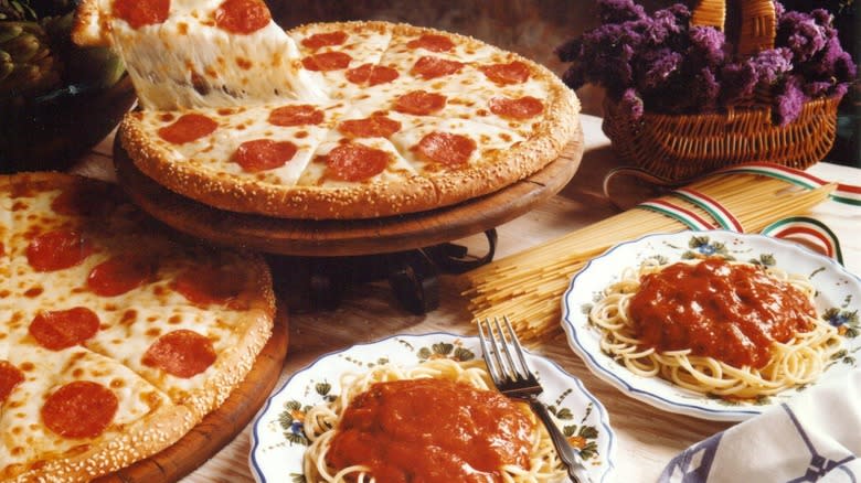 spaghetti and pepperoni pizzas