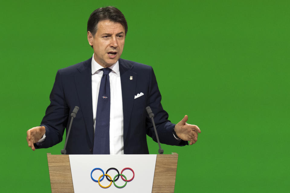 Italy's Prime Minister Giuseppe Conte speaks during the presentation final presentation of the Milan-Cortina candidate cities the first day of the 134th Session of the International Olympic Committee (IOC), at the SwissTech Convention Centre, in Lausanne, Switzerland, Monday, June 24, 2019. The host city of the 2026 Olympic Winter Games will be decided during the134th IOC Session. Stockholm-Are in Sweden and Milan-Cortina in Italy are the two candidate cities for the Olympic Winter Games 2026. (Laurent Gillieron/Keystone via AP)