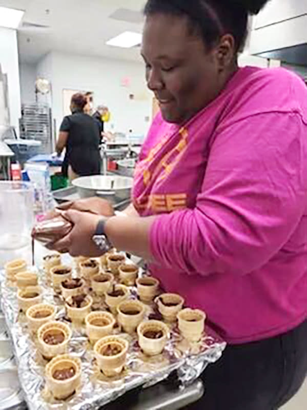 Saniyya Boykin fills dessert cones for a student celebration.  (Courtesy Heather Webb)