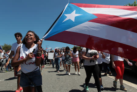 Students of the University of Puerto Rico protest as a meeting of the Financial Oversight and Management Board for Puerto Rico is taking place at the Convention Center in San Juan, Puerto Rico March 31, 2017. Picture taken March 31, 2017. REUTERS/Alvin Baez