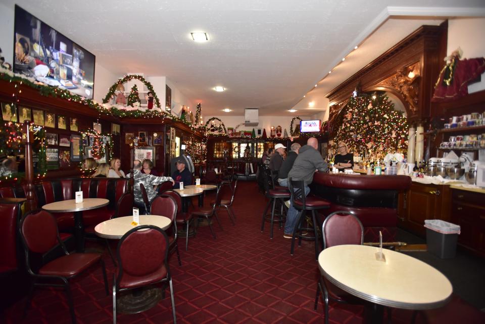Patrons enjoy an afternoon drink at the Brass Rail Bar located on Huron Avenue in downtown Port Huron, on Wednesday, Dec. 7, 2022.