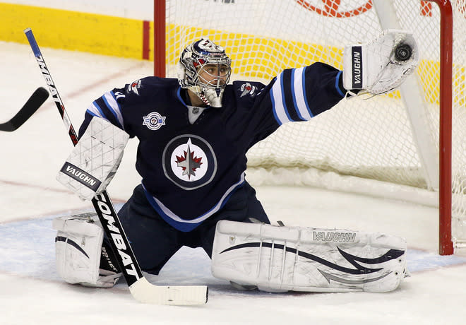 WINNIPEG, CANADA - FEBRUARY 27: Ondrej Pavelec #31 of the Winnipeg Jets makes a save in a game against the Edmonton Oilers in NHL action at the MTS Centre on February 27, 2012 in Winnipeg, Manitoba, Canada. (Photo by Marianne Helm/Getty Images) *** BESTPIX ***