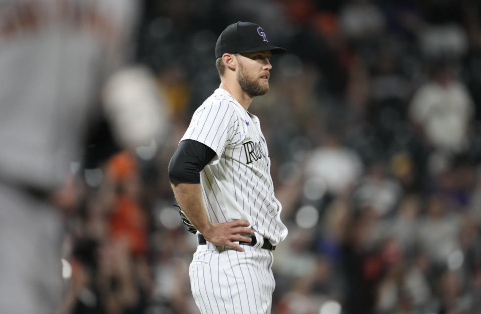 Colorado Rockies relief pitcher Daniel Bard reacts after giving up a solo home run to San Francisco Giants' Mike Yastrzemski in the ninth inning of a baseball game Monday, May 16, 2022, in Denver. (AP Photo/David Zalubowski)