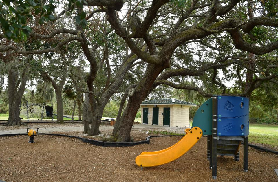 A slide at Locklear Park, which offers ample shade and play structures for children.