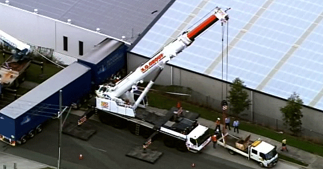 The truck went over an embankment and into the side of a building.